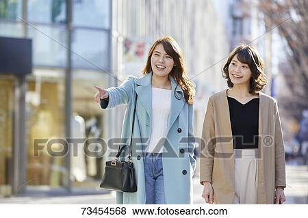 Japanese women window shopping downtown Tokyo View Large Photo Image Stock Photo - Japanese women window shopping downtown Tokyo. Fotosearch