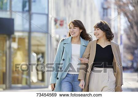 Japanese women window shopping downtown Tokyo View Large Photo Image Stock Photo - Japanese women window shopping downtown Tokyo. Fotosearch