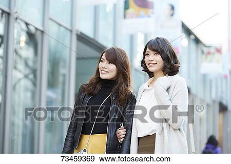 Japanese women window shopping downtown Tokyo View Large Photo Image Stock Photo - Japanese women window shopping downtown Tokyo. Fotosearch
