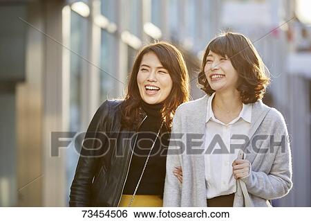 Japanese women window shopping downtown Tokyo View Large Photo Image Stock Photograph - Japanese women window shopping downtown Tokyo. Fotosearch