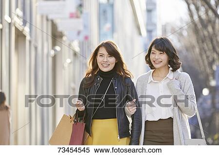Japanese women window shopping downtown Tokyo View Large Photo Image Stock Photography - Japanese women window shopping downtown Tokyo. Fotosearch