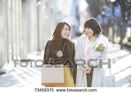 Japanese women window shopping downtown Tokyo View Large Photo Image Stock Photography - Japanese women window shopping downtown Tokyo. Fotosearch