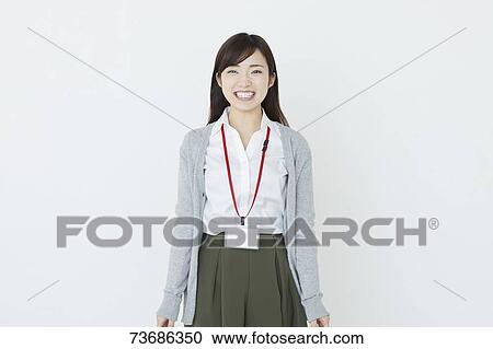 Stock Image - Japanese young woman on white background. Fotosearch