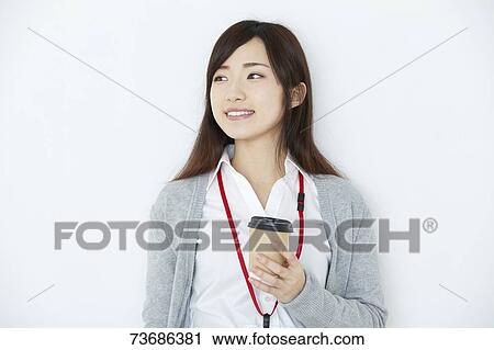 Stock Image - Japanese young woman on white background. Fotosearch