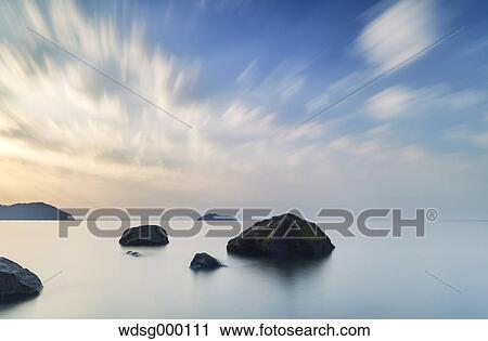 Stock Image - Long exposure of Lake Biwa at sunrise, Shiga Prefecture, Japan. Fotosearch