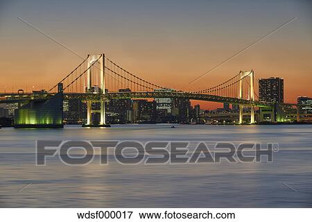 Long exposure shot of Rainbow Bridge at sunset, Tokyo, Japan View Large Photo Image Stock Photo - Long exposure shot of Rainbow Bridge at sunset, Tokyo, Japan. Fotosearch