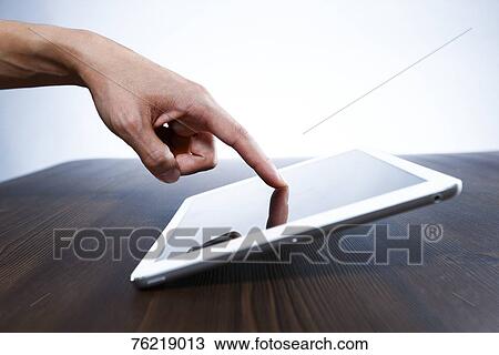 Male hand working on tablet View Large Photo Image Stock Image - Male hand working on tablet. Fotosearch