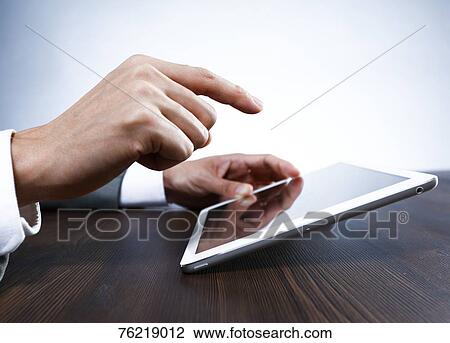 Male hands working on tablet View Large Photo Image Stock Image - Male hands working on tablet. Fotosearch