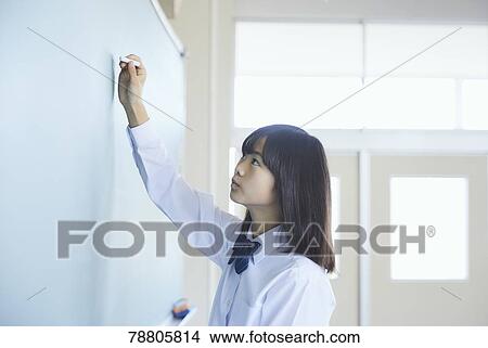 Picture - Mixed-race student in the classroom. Fotosearch