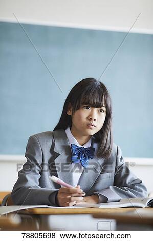 Mixed-race student in the classroom View Large Photo Image Stock Photo - Mixed-race student in the classroom. Fotosearch