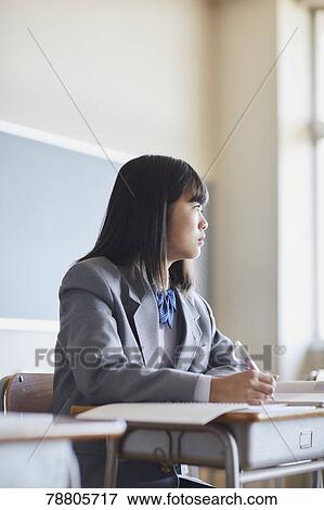 Mixed-race student in the classroom View Large Photo Image Stock Photo - Mixed-race student in the classroom. Fotosearch