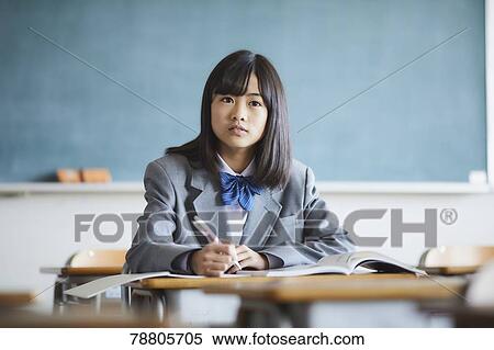 Mixed-race student in the classroom View Large Photo Image Stock Photography - Mixed-race student in the classroom. Fotosearch