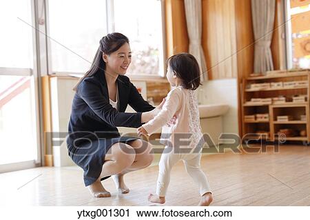 Mother picking up her kid at Japanese kindergarten View Large Photo Image Stock Image - Mother picking up her kid at Japanese kindergarten. Fotosearch