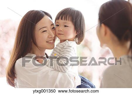 Mother picking up her kid at Japanese kindergarten View Large Photo Image Stock Image - Mother picking up her kid at Japanese kindergarten. Fotosearch