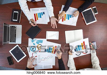 Stock Image - Multi-ethnic group having a business meeting. Fotosearch