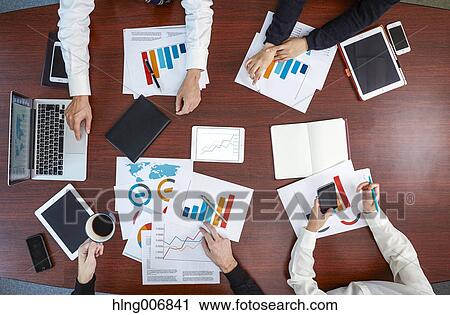 Multi-ethnic group having a business meeting View Large Photo Image Stock Image - Multi-ethnic group having a business meeting. Fotosearch