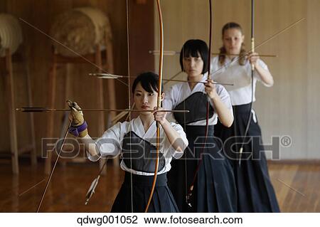 Multi-ethnic group of traditional archery athletes practicing View Large Photo Image Stock Image - Multi-ethnic group of traditional archery athletes practicing. Fotosearch