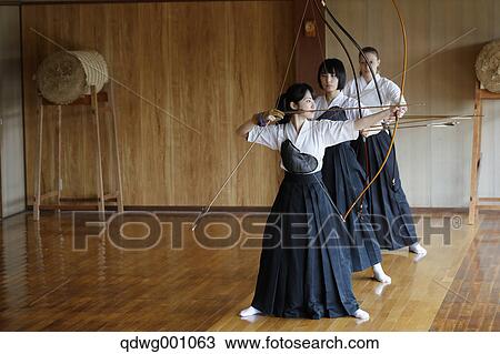 Multi-ethnic group of traditional archery athletes practicing View Large Photo Image Stock Image - Multi-ethnic group of traditional archery athletes practicing. Fotosearch