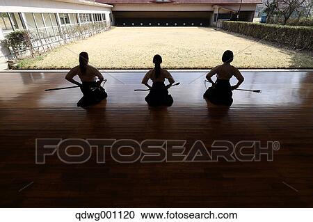 Stock Image - Multi-ethnic group of traditional archery athletes practicing. Fotosearch