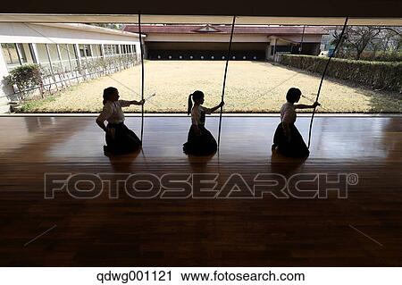 Stock Image - Multi-ethnic group of traditional archery athletes practicing. Fotosearch