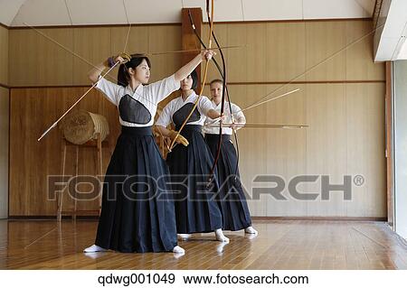 Multi-ethnic group of traditional archery athletes practicing View Large Photo Image Stock Photo - Multi-ethnic group of traditional archery athletes practicing. Fotosearch