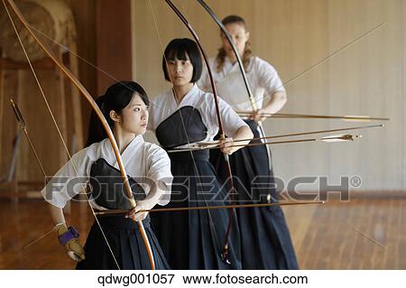 Multi-ethnic group of traditional archery athletes practicing View Large Photo Image Stock Photo - Multi-ethnic group of traditional archery athletes practicing. Fotosearch