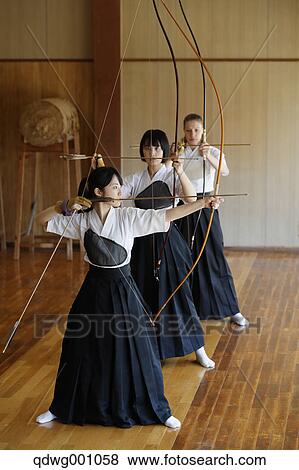 Multi-ethnic group of traditional archery athletes practicing View Large Photo Image Stock Photo - Multi-ethnic group of traditional archery athletes practicing. Fotosearch