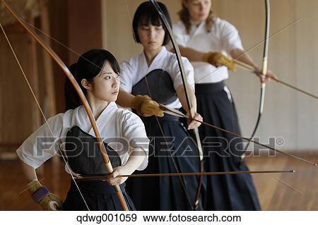 Multi-ethnic group of traditional archery athletes practicing View Large Photo Image Stock Photo - Multi-ethnic group of traditional archery athletes practicing. Fotosearch