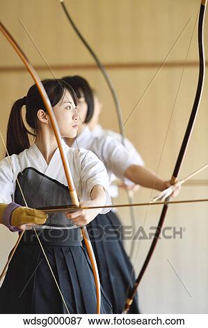 Multi-ethnic group of traditional archery athletes practicing View Large Photo Image Stock Photo - Multi-ethnic group of traditional archery athletes practicing. Fotosearch