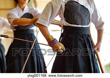 Multi-ethnic group of traditional archery athletes practicing View Large Photo Image Stock Photo - Multi-ethnic group of traditional archery athletes practicing. Fotosearch