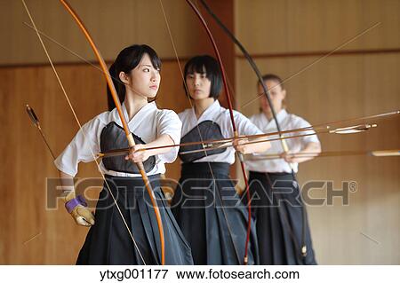 Multi-ethnic group of traditional archery athletes practicing View Large Photo Image Stock Photo - Multi-ethnic group of traditional archery athletes practicing. Fotosearch