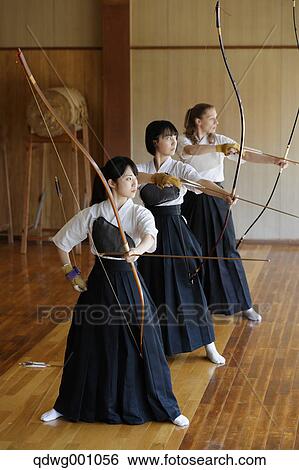 Multi-ethnic group of traditional archery athletes practicing View Large Photo Image Stock Photograph - Multi-ethnic group of traditional archery athletes practicing. Fotosearch