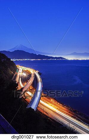 Night view of Mount Fuji and highway from Satta ridge at sunset, Shizuoka Prefecture, Japan View Large Photo Image Stock Photo - Night view of Mount Fuji and highway from Satta ridge at sunset, Shizuoka Prefecture, Japan. Fotosearch