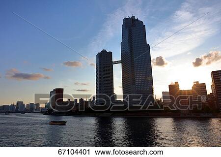 Stock Image - Office buildings and sky, Tokyo, Japan. Fotosearch
