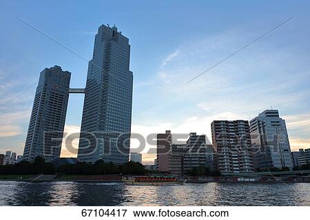 Stock Photo - Office buildings and sky, Tokyo, Japan. Fotosearch