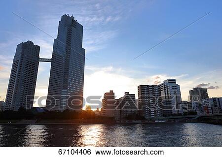 Stock Photograph - Office buildings and sky, Tokyo, Japan. Fotosearch
