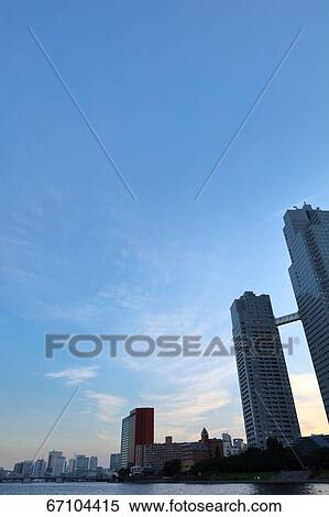 Stock Photography - Office buildings and sky, Tokyo, Japan. Fotosearch