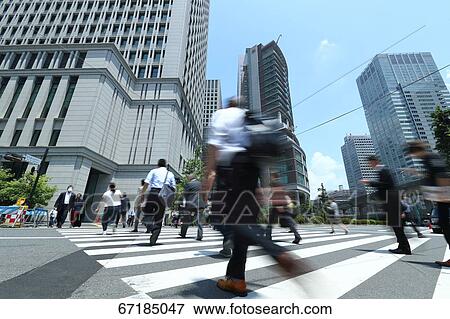 Stock Photo - Pedestrians walking in Tokyo, Japan. Fotosearch