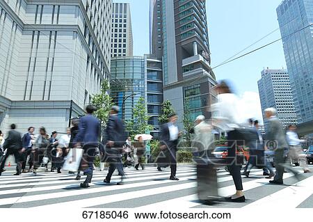 Stock Photograph - Pedestrians walking in Tokyo, Japan. Fotosearch