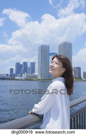 Portrait of young Japanese woman downtown Tokyo, Japan View Large Photo Image Stock Photo - Portrait of young Japanese woman downtown Tokyo, Japan. Fotosearch