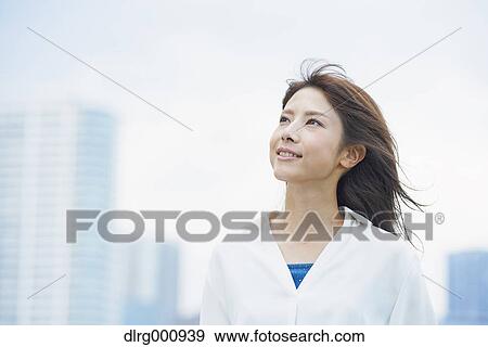 Portrait of young Japanese woman downtown Tokyo, Japan View Large Photo Image Stock Photo - Portrait of young Japanese woman downtown Tokyo, Japan. Fotosearch