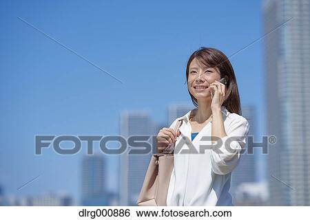 Portrait of young Japanese woman downtown Tokyo, Japan View Large Photo Image Stock Photograph - Portrait of young Japanese woman downtown Tokyo, Japan. Fotosearch