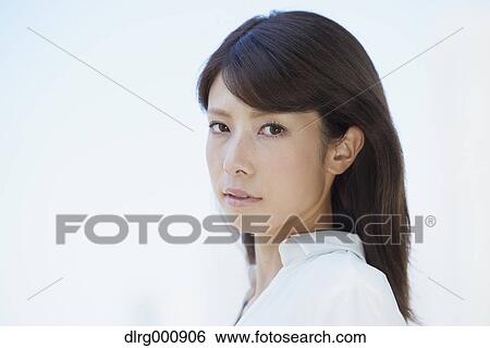 Portrait of young Japanese woman downtown Tokyo, Japan View Large Photo Image Stock Photograph - Portrait of young Japanese woman downtown Tokyo, Japan. Fotosearch