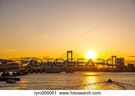Stock Image - Rainbow bridge at sunset, Tokyo, Japan. Fotosearch
