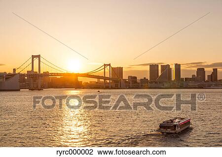 Stock Image - Rainbow bridge at sunset, Tokyo, Japan. Fotosearch