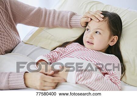 Sick Japanese kid in bed View Large Photo Image Stock Image - Sick Japanese kid in bed. Fotosearch