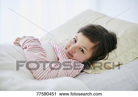 Sick Japanese kid in bed View Large Photo Image Stock Image - Sick Japanese kid in bed. Fotosearch