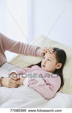 Sick Japanese kid in bed View Large Photo Image Stock Photo - Sick Japanese kid in bed. Fotosearch