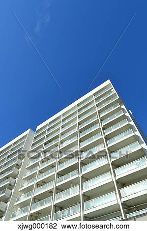 Stock Image - Skyscraper and blue sky, Tokyo, Japan. Fotosearch