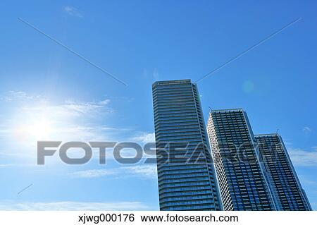 Stock Photograph - Skyscrapers and blue sky, Tokyo, Japan. Fotosearch